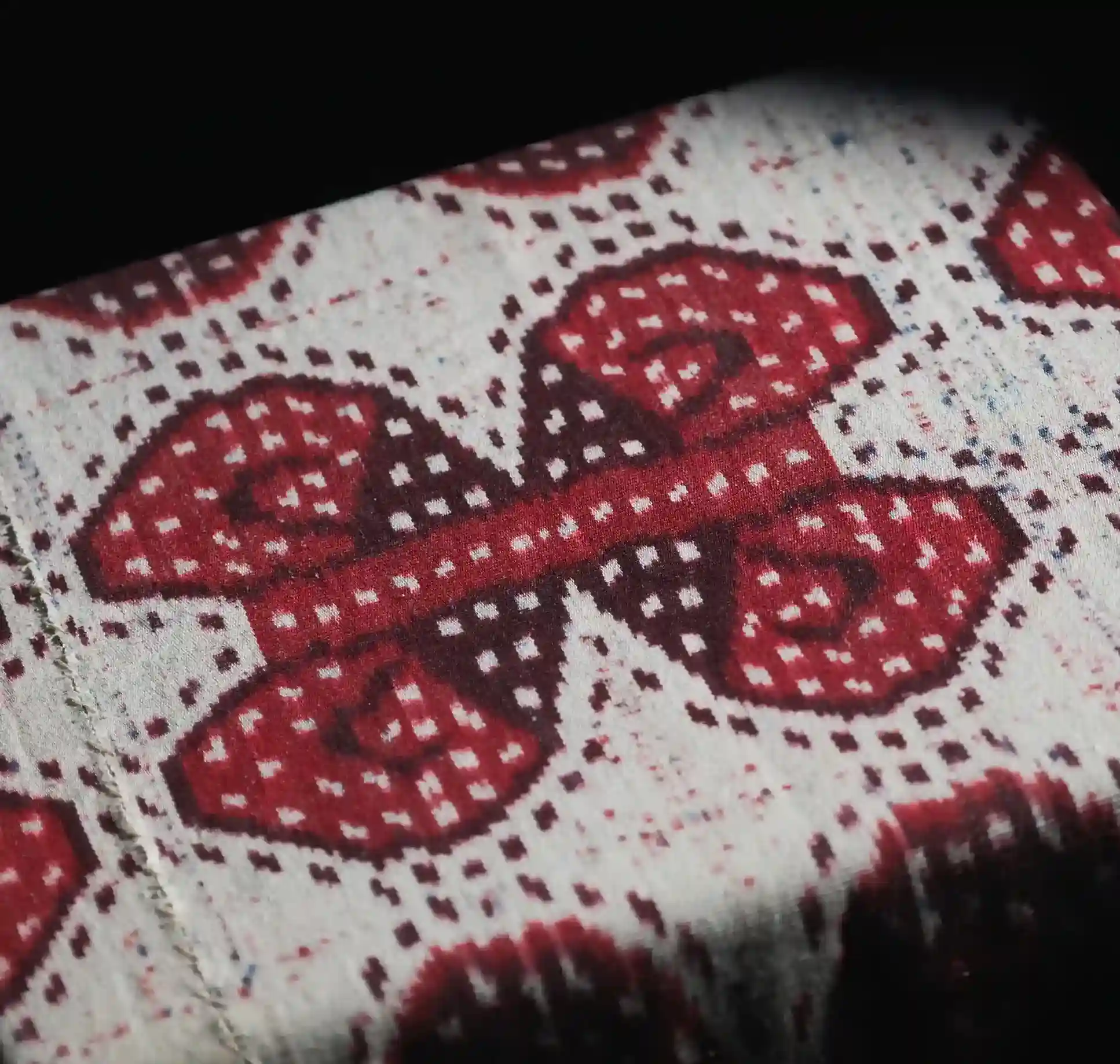 Close detail of Sumba ikat showing the feathered pattern edge